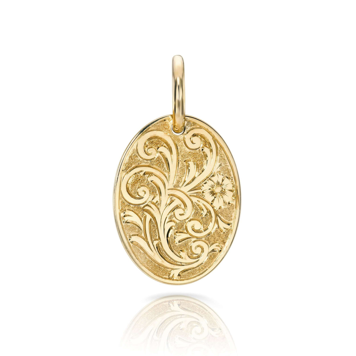 SINGLE STONE 20mm FLORAL ENGRAVED OVAL PENDANT PENDANT featuring Handcrafted 20mm floral engraved oval shaped pendant in 18K yellow gold. Price does not include chain.