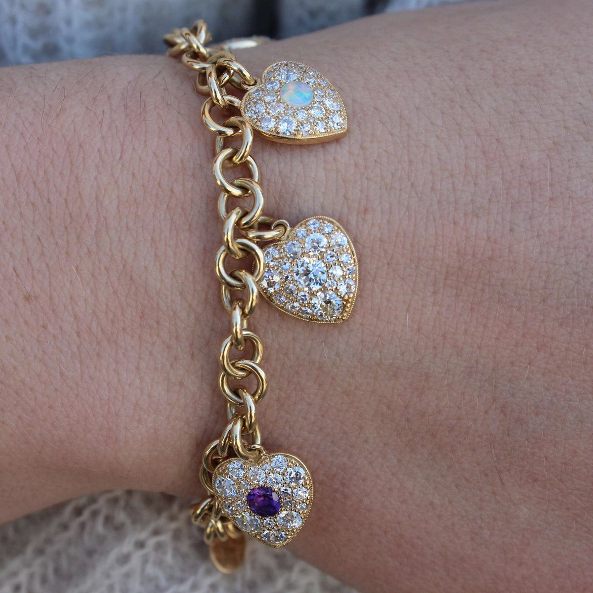 SINGLE STONE ADORE BRACELET featuring Gemstones in each heart charm are arranged in order (amethyst, diamond, opal, ruby and emerald) to spell ADORE in this Victorian-inspired charm bracelet. A total 4.14ctw varying antique cut diamonds and 0.92ctw center