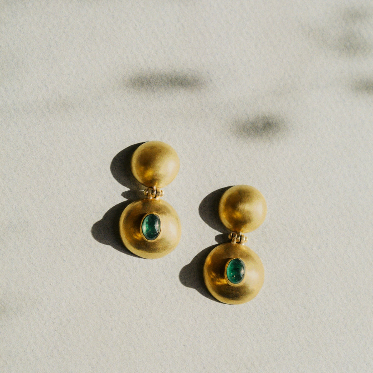EMERALD DOUBLE DOME BULLA EARRINGS, 22k yellow gold
Cabochon emeralds
Made in New York
, Earrings, PROUNIS