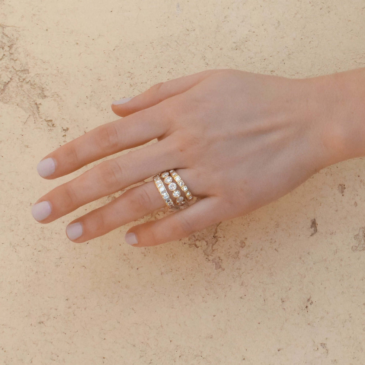 SINGLE STONE ATHENA BAND | Approximately 2.50ctw H-I/VS emerald cut diamonds bezel set in a handcrafted eternity band. Approximate band width 4mm. Please inquire for additional customization.