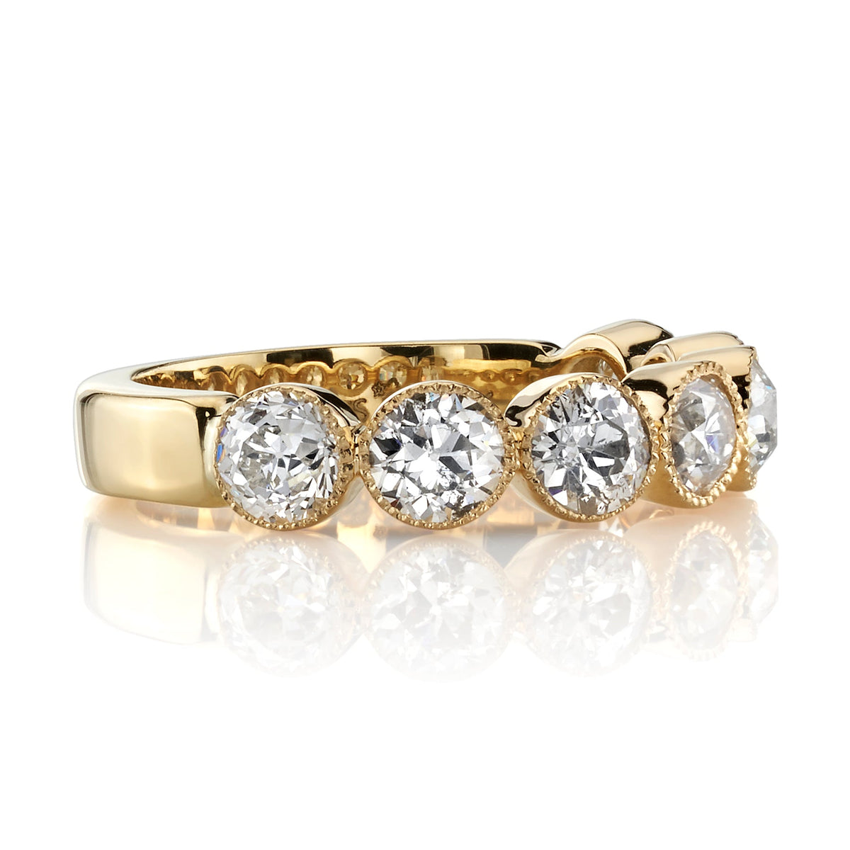SINGLE STONE LARGE GABBY HALF BAND BAND | Approximately 1.50-1.70ctw old European cut diamonds set in a handcrafted bezel set half-eternity band. Approximate band width 4.8mm.
