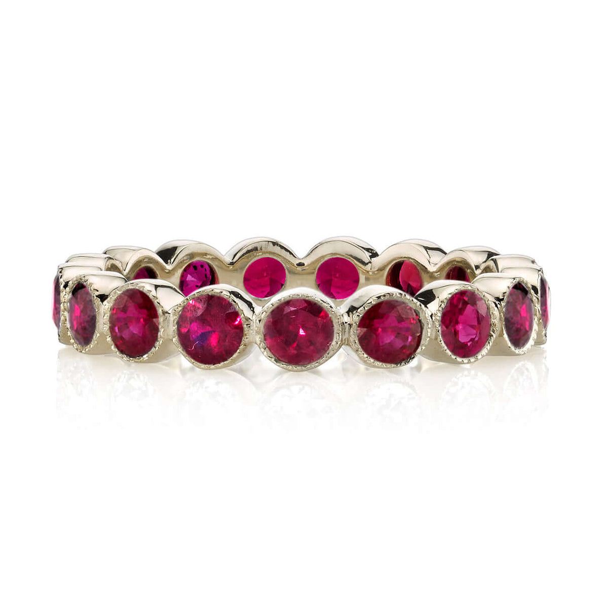 SINGLE STONE MEDIUM GABBY WITH GEMSTONES BAND | Approximately 2.30ctw round cut gemstones bezel set in a handcrafted eternity band. Approximate band with 3.6mm. Please inquire for additional customization.