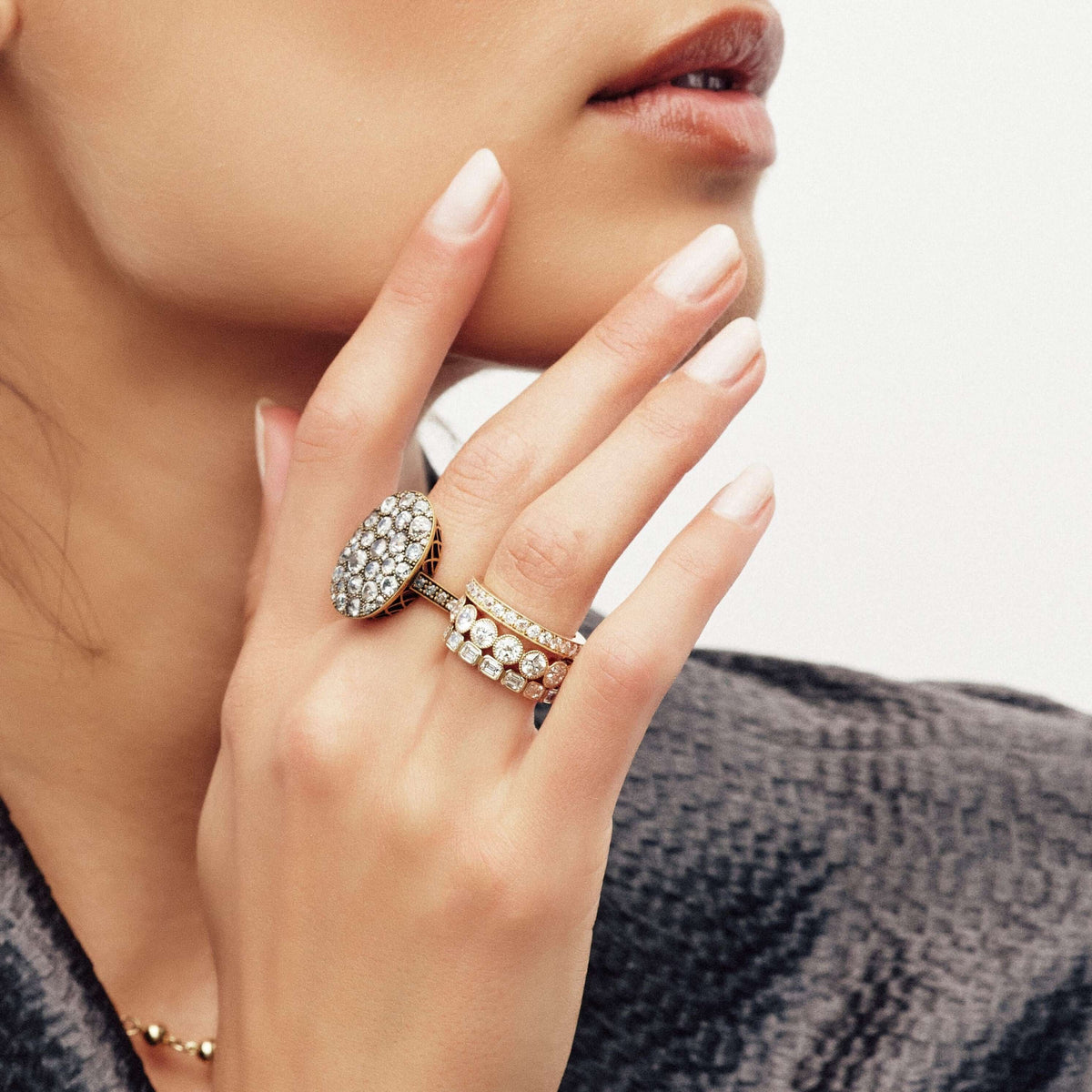 SINGLE STONE LARGE GABBY BAND | Approximately 1.50-1.70ctw old European cut diamonds set in a handcrafted bezel set half-eternity band. Approximate band width 4.8mm.