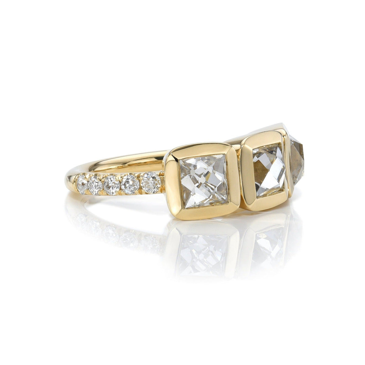 SINGLE STONE THREE STONE KARINA RING featuring 2.76ctw F-G/VS2-SI1 GIA certified French cut diamonds with 0.31ctw old European cut accent diamonds set in a handcrafted 18K yellow gold mounting.