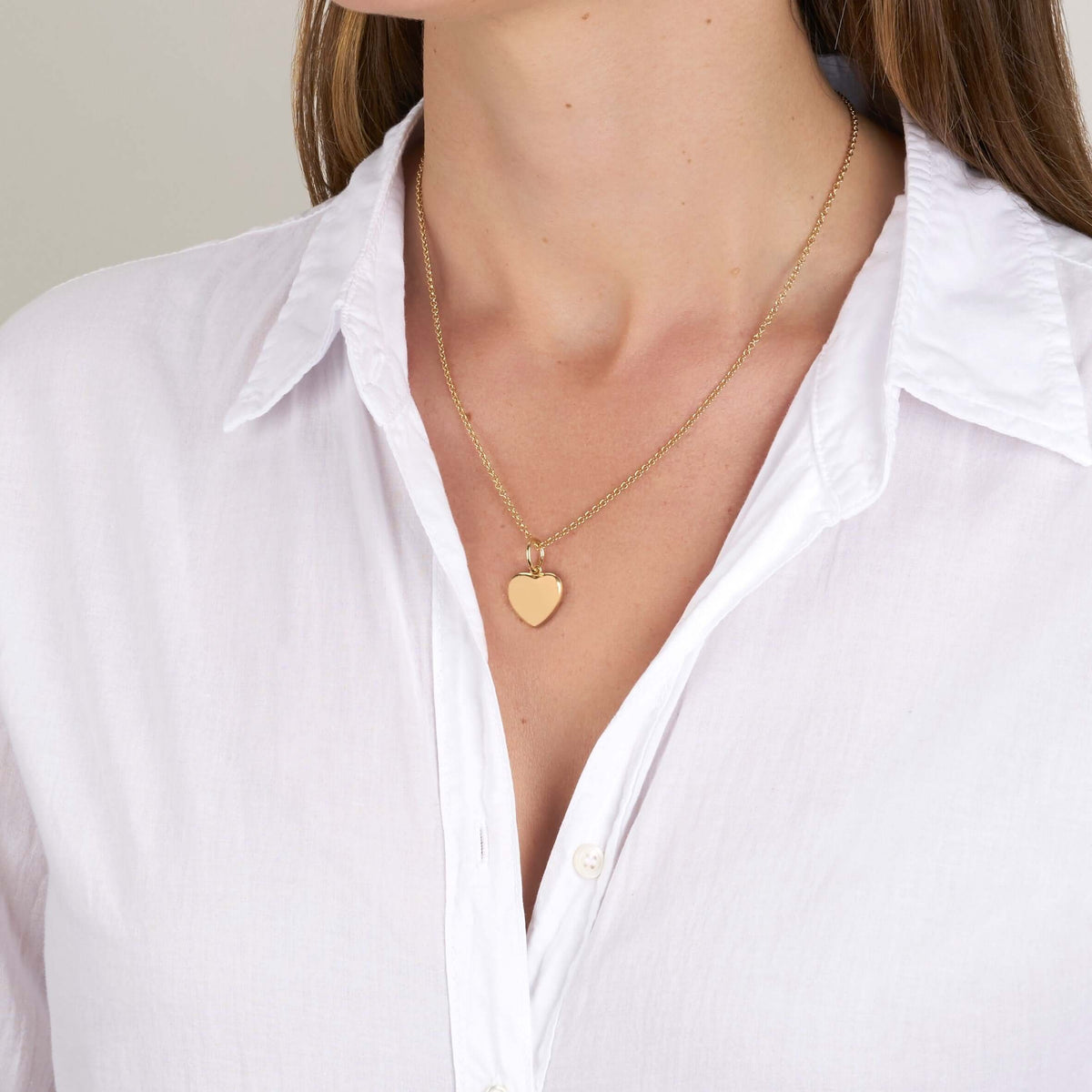 SINGLE STONE VIOLA PENDANT featuring Handcrafted 18K yellow gold heart-shaped charm. -Every year, 12 million girls are married before the age of 18...that’s one girl every three seconds. We designed this beautiful heart charm with Vow for Girls. For every