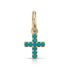 SINGLE STONE MINI CARMELA CROSS WITH GEMSTONES PENDANT featuring Approximately 0.15ctw round cut gemstones prong set in a handcrafted 18K yellow gold cross. Cross measures 8.20mm x 9.80mm. Price does not include chain.