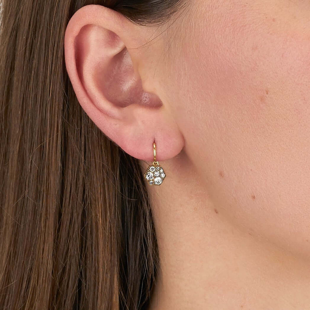 SINGLE STONE HEXAGON COBBLESTONE DROPS | Earrings featuring 0.60ctw varying old cut and round brilliant cut diamonds set in handcrafted, oxidized 18K yellow gold drop earrings. Price may vary according to diamond weight. *Cobblestone pattern may vary from