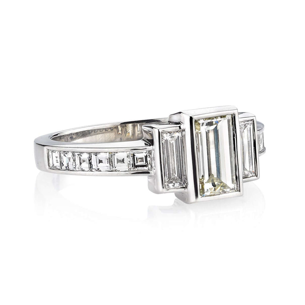SINGLE STONE LISA RING featuring 0.88ct L/VS1 GIA certified rectangular step cut diamond with 0.72ctw mixed cut accent diamonds set in a handcrafted platinum mounting.