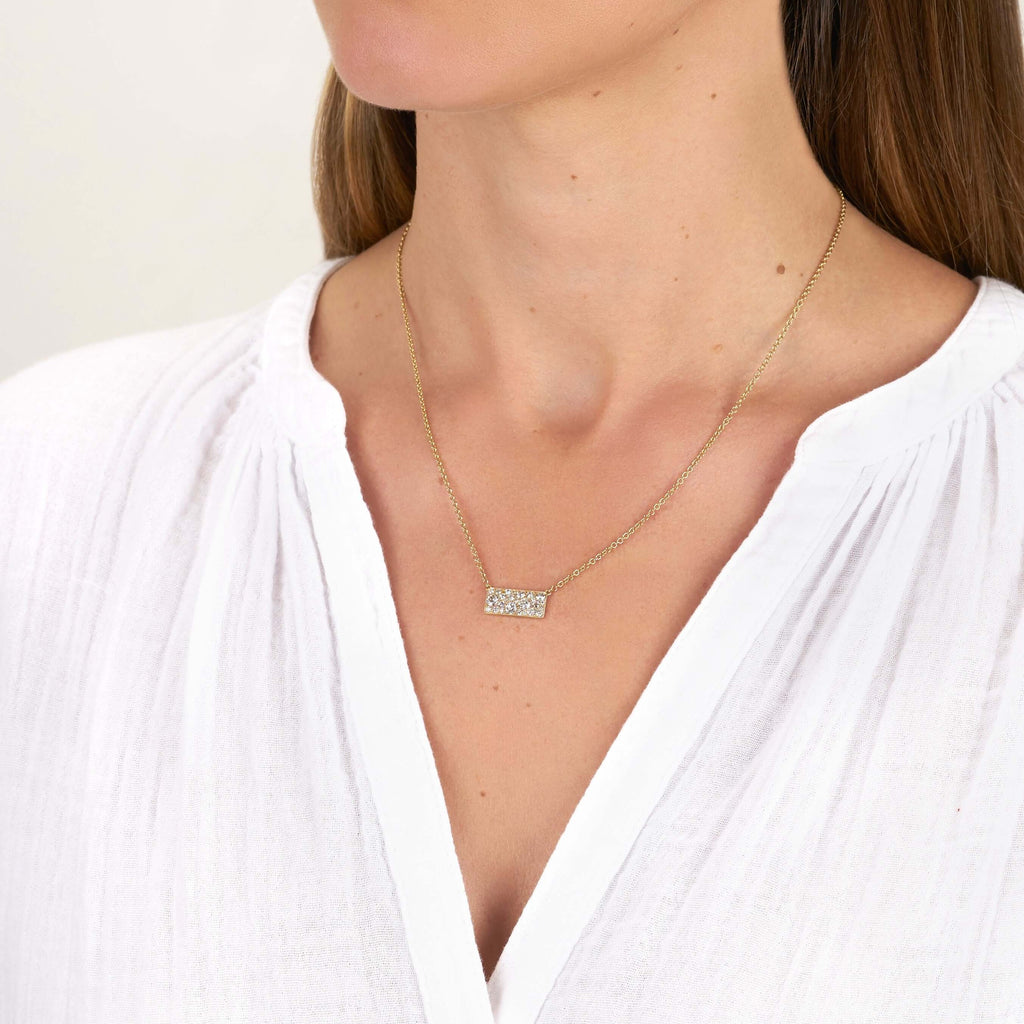 SINGLE STONE MILO COBBLESTONE PENDANT NECKLACE featuring Approximately 0.95ctw varying old cut and round brilliant cut diamonds set in a handcrafted 18K yellow gold pendant. Necklace measures 18". Price may vary according to total diamond weight. Availabl