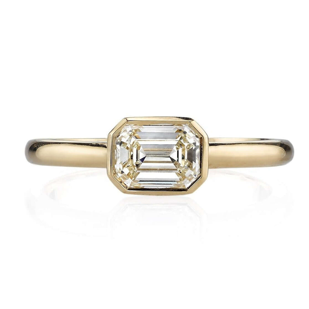 SINGLE STONE LEAH RING featuring 1.03ctw J/VVS1 HRD certified emerald cut diamond set in a handcrafted 18K yellow gold mounting.