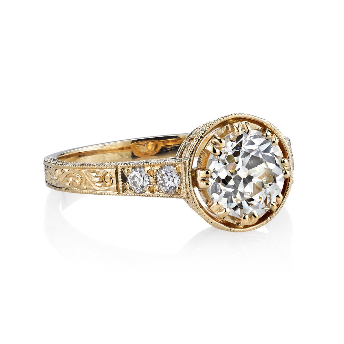 SINGLE STONE AUBREY RING featuring 1.20ct J/VS2 EGL certified old European cut diamond with 0.13ctw old European cut accent diamonds set in a handcrafted 18K yellow gold mounting.