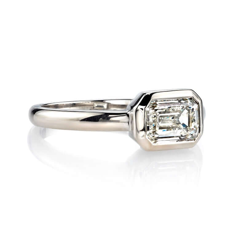 SINGLE STONE MARNI RING featuring 1.20ct L/VVS1 GIA certified emerald cut diamond set in a handcrafted 18K champagne gold mounting.