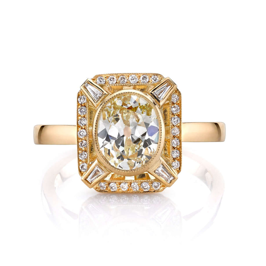 SINGLE STONE JENNIFER RING featuring 1.31ct L/VS1 EGL certified antique oval cut diamond with 0.16ctw mixed cut accent diamonds set in a handcrafted 18K yellow gold mounting.