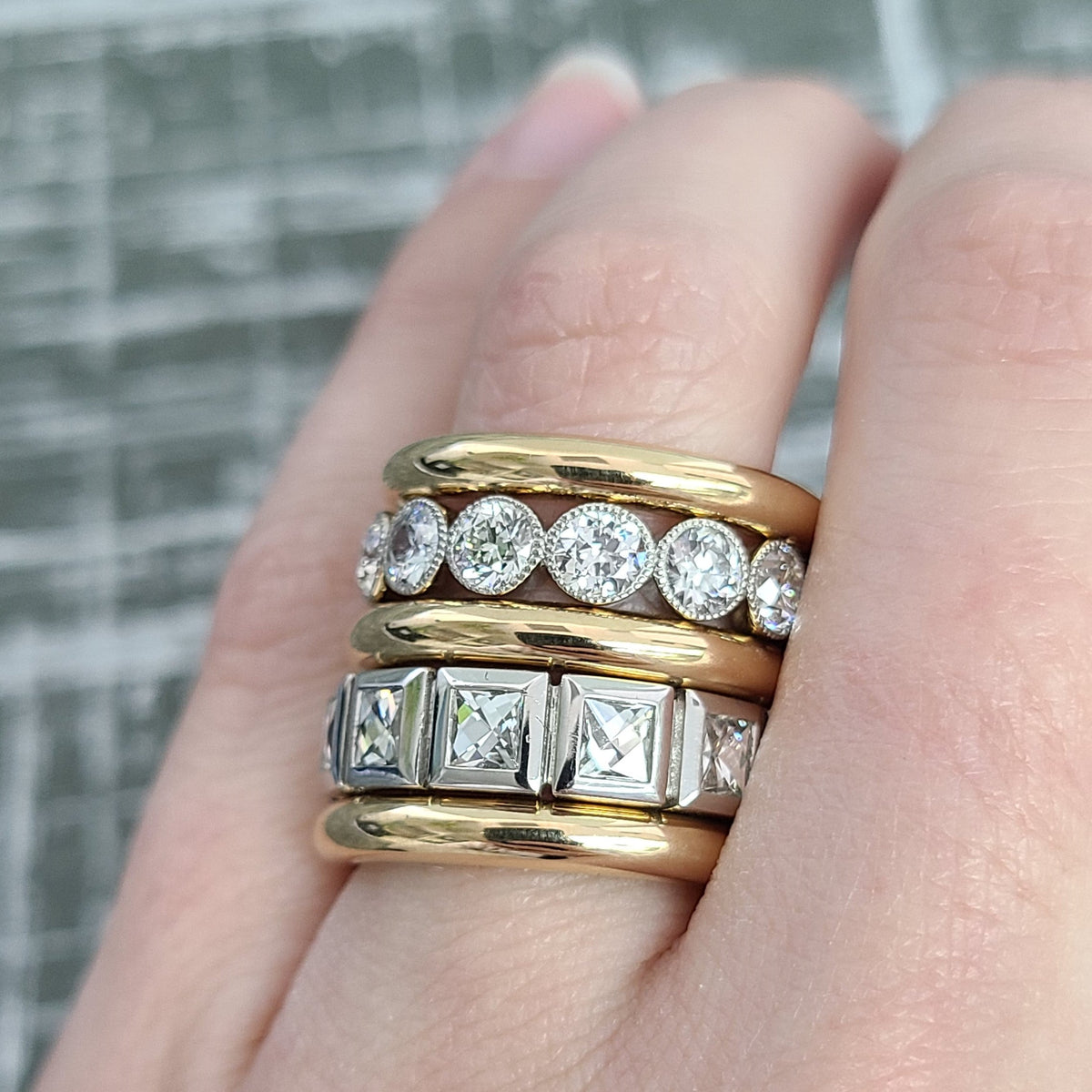 SINGLE STONE LARGE KARINA BAND | Approximately 2.50ctw G-H/VS French cut diamonds bezel set in a handcrafted eternity band. Approximate band width 5.5mm. Please inquire for additional customization.