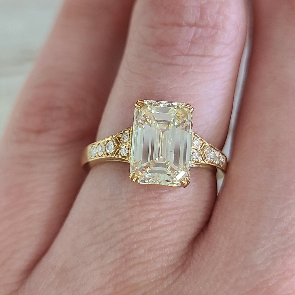 SINGLE STONE LORRAINE RING featuring 2.00ct M/VS2 GIA certified emerald cut diamond with 0.10ctw old European cut accent diamonds set in a handcrafted 18K yellow gold mounting.