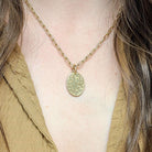 SINGLE STONE 20mm FLORAL ENGRAVED OVAL PENDANT PENDANT featuring Handcrafted 20mm floral engraved oval shaped pendant in 18K yellow gold. Price does not include chain.
