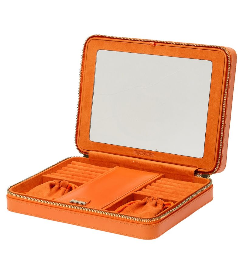 MARIA LARGE ZIP CASE, Material: Leather 
Storage: 10 ring rolls, 2 open compartments, 1 lidded compartment, 2 drawstring pouches,  6 necklace snap-on hooks with pocket, 1 ring bar, one earring bar. 
LusterLoc™: Allows the fabric lining the inside of your jewellery cases to absorb the hostile gases known to cause tarnishing. Under typical storage conditions, it can prevent tarnishing for up to 35 years 

, Gifts, WOLF DESIGNS, INC