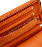 MARIA MEDIUM ZIP CASE, Material: Leather 
Storage: 1 earring tab, 1 ring tab, 1 zip pocket, double multi-purpose zip pouch with 4 storage compartments, 3 snap-on necklace hooks with pocket. 
LusterLoc™: Allows the fabric lining the inside of your jewellery cases to absorb the hostile gases known to cause tarnishing. Under typical storage conditions, it can prevent tarnishing for up to 35 years 

, Gifts, WOLF DESIGNS, INC