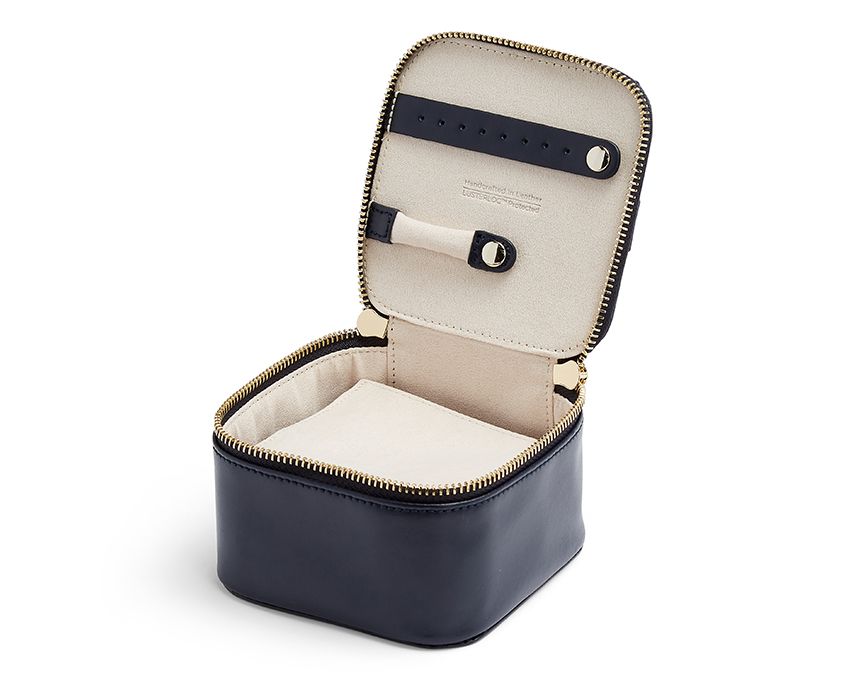 MARIA ZIP JEWELRY CUBE - NAVY, Storage: 1 ring bar, 1 earring bar, 5 zip compartments LusterLoc™: Allows the fabric lining the inside of your jewellery cases to absorb the hostile gases known to cause tarnishing. Under typical storage conditions, it can p