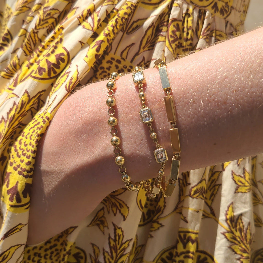 SINGLE STONE GIANA BRACELET featuring Handcrafted 18K yellow gold full bar bracelet. Bracelet measures 7.5".