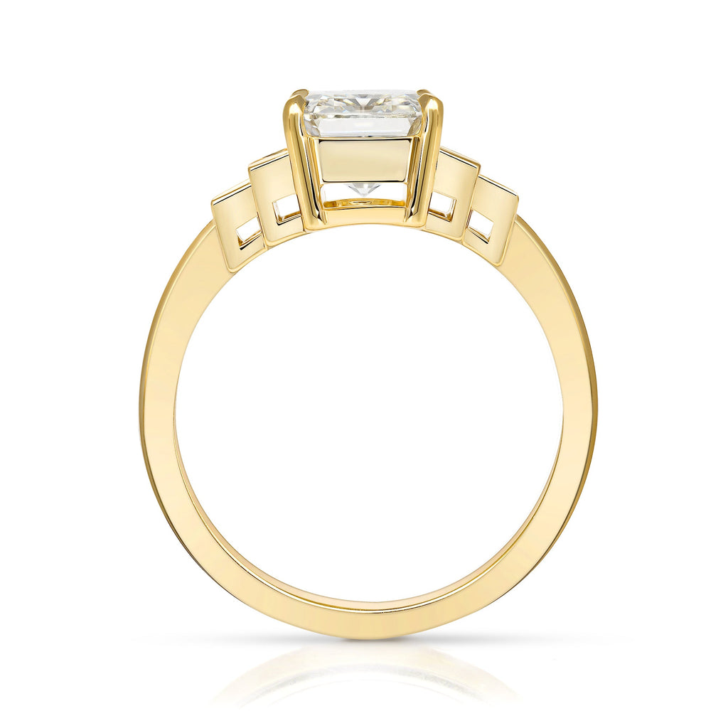 SINGLE STONE CAROLINE RING featuring 2.31ct K/VS1 GIA certified emerald cut diamond with 0.44ctw baguette cut accent diamonds prong set in a handcrafted 18K yellow gold mounting.