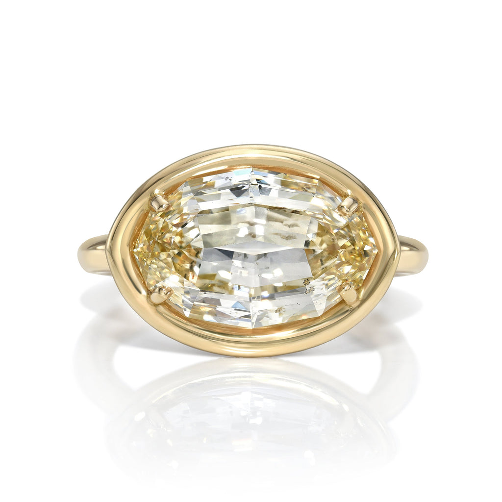SINGLE STONE DEVI RING featuring 5.21ct Fancy Lt. Brownish Yellow/SI2 GIA certified oval cut diamond with 0.85ctw old European cut accent diamonds set in a handcrafted 18K yellow gold mounting.