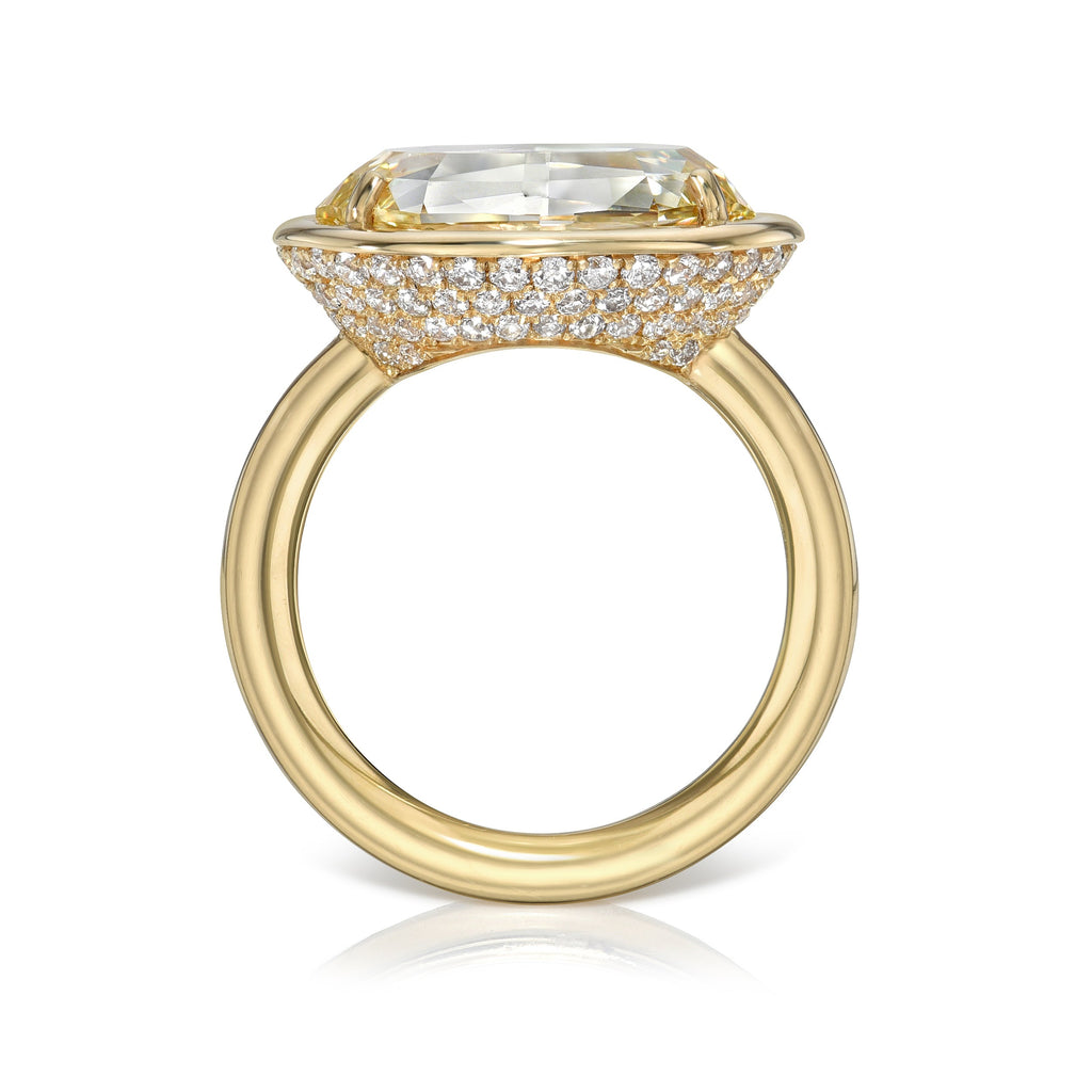 SINGLE STONE DEVI RING featuring 5.21ct Fancy Lt. Brownish Yellow/SI2 GIA certified oval cut diamond with 0.85ctw old European cut accent diamonds set in a handcrafted 18K yellow gold mounting.