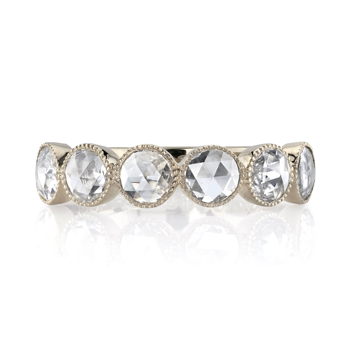 SINGLE STONE LARGE ROSE CUT GABBY HALF BAND BAND | ﻿Approximately 0.90ctw rose cut diamonds set in a handcrafted bezel set half-eternity band. Approximate band width 4.8mm. Please inquire for additional customization.