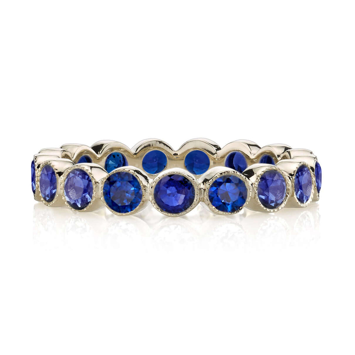SINGLE STONE MEDIUM GABBY WITH GEMSTONES BAND | Approximately 2.30ctw round cut gemstones bezel set in a handcrafted eternity band. Approximate band with 3.6mm. Please inquire for additional customization.