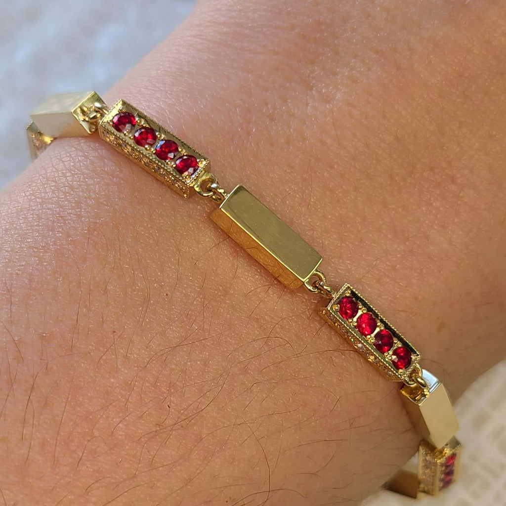 SINGLE STONE GIANA BRACELET WITH DIAMONDS AND GEMSTONES featuring Approximately 1.25ctw G-H/VS old European cut diamonds with 2.75ctw round cut color gemstones set on a handcrafted 18K yellow gold full bar bracelet. Bracelet measures 7.5"