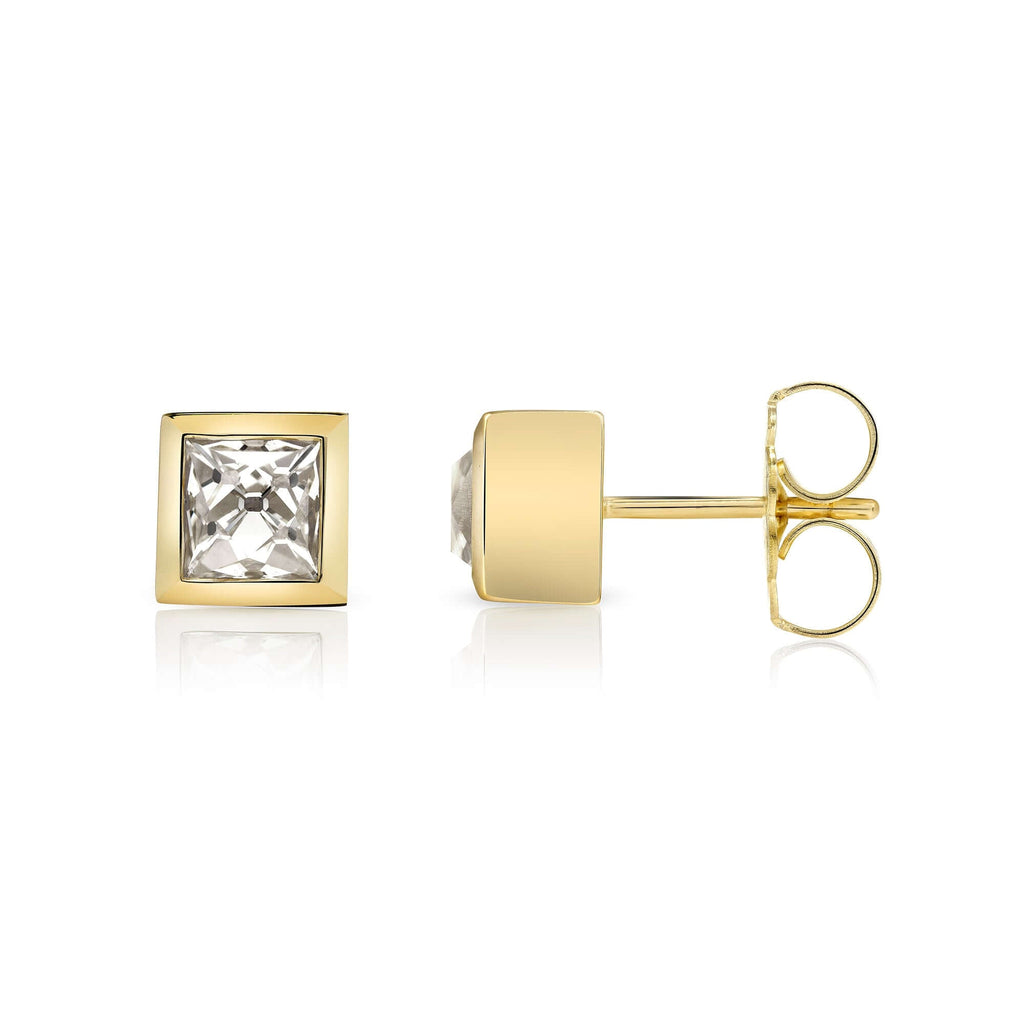 SINGLE STONE KARINA STUDS | Earrings featuring 2.25ctw K/VS2 GIA certified French cut diamonds bezel set in handcrafted 18K yellow gold stud earrings.