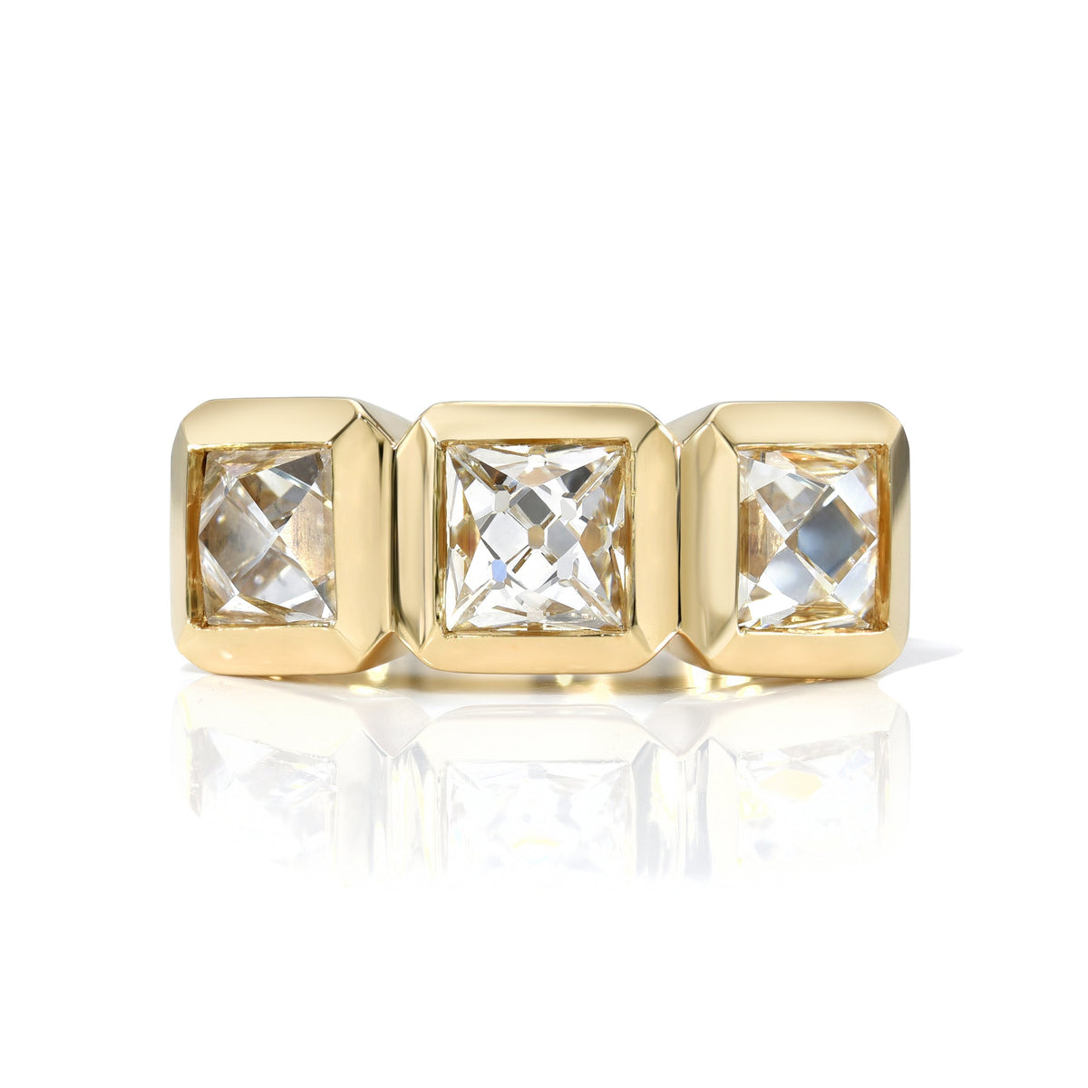 SINGLE STONE THREE STONE KARINA RING featuring 2.93ctw F-H/VS1-VS2-I1 GIA certified French cut diamonds with 0.24ctw square French cut rubies bezel set in a handcrafted 18K yellow gold mounting.
