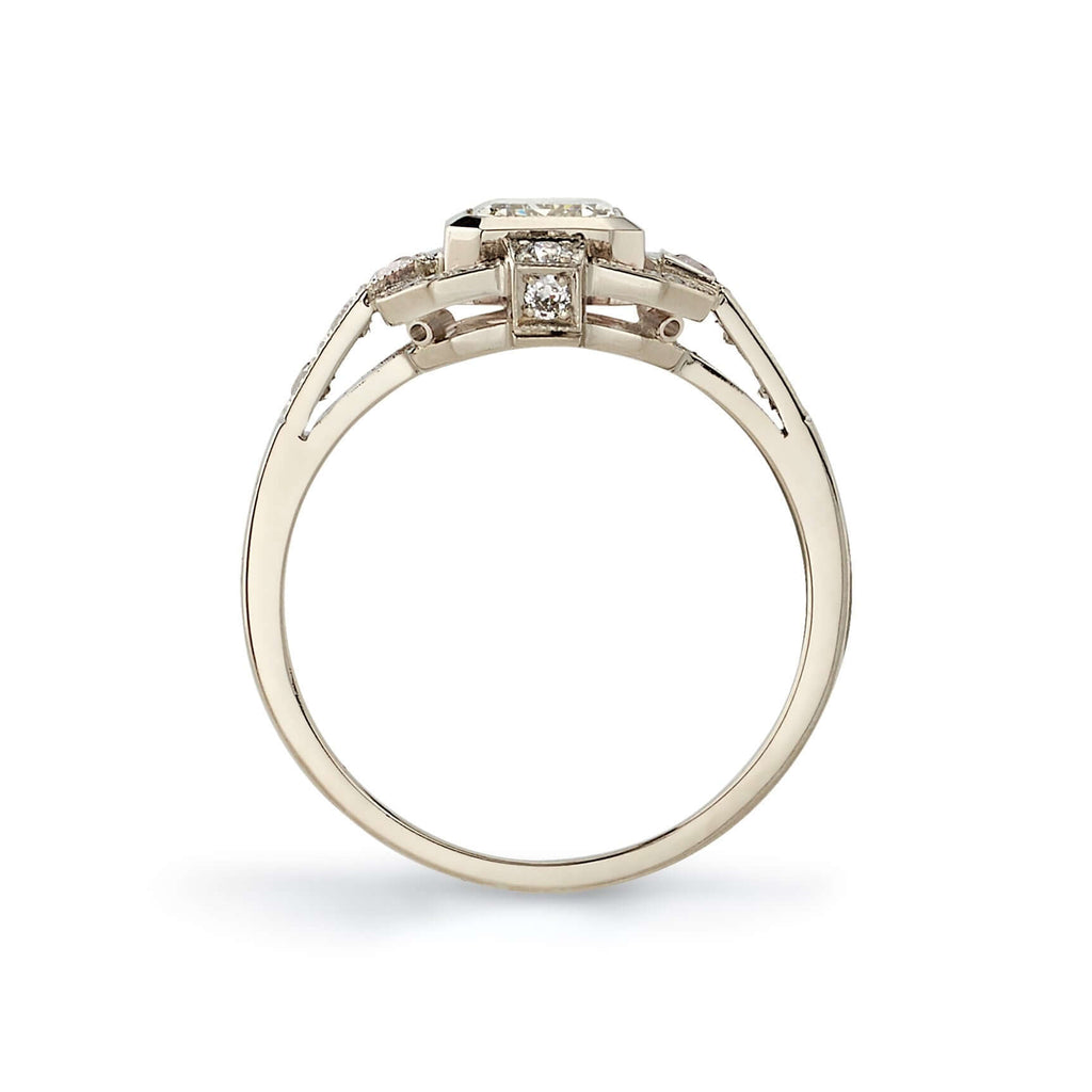 SINGLE STONE KATIE RING featuring 1.01ct N/VS2 GIA certified emerald cut diamond with 0.34ctw old European cut accent diamonds set in a handcrafted 18K champagne white gold mounting.