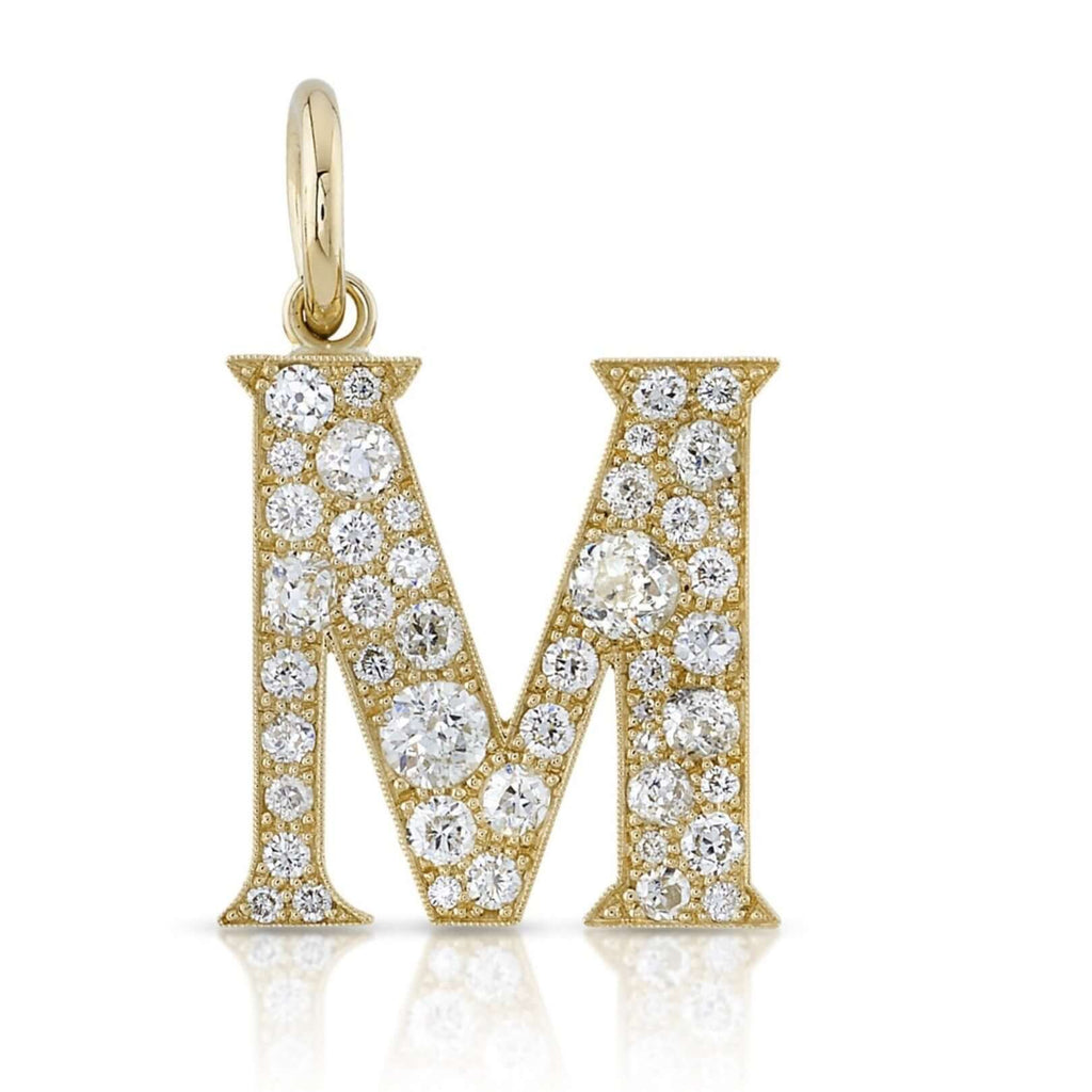 SINGLE STONE LARGE COBBLESTONE LETTERS PENDANT featuring Approximately 0.95ctw-2.75ctw varying old cut and round brilliant cut diamonds set in a handcrafted 18K yellow gold letter pendant. Letters are approximately 1" tall. Available in an oxidized or pol