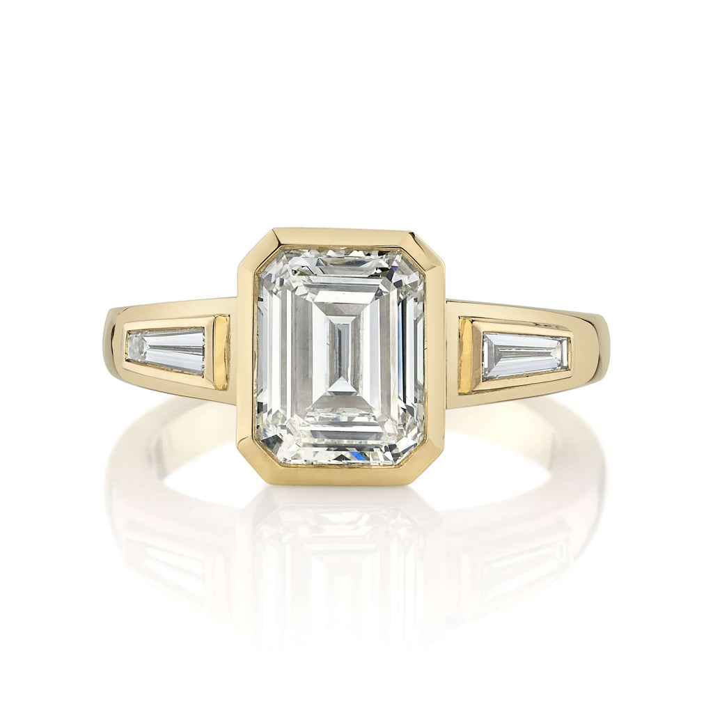 SINGLE STONE LAURIE RING featuring 2.00ct N/VS2 GIA certified emerald cut diamond with 0.24ctw baguette cut accent diamonds bezel set in a handcrafted 18K yellow gold mounting.