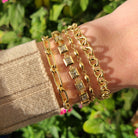 SINGLE STONE MINI CLUB BRACELET featuring Handcrafted 18K yellow gold small link bracelet. Charms sold separately. Bracelet measures 7.5". Please inquire for additional customization.