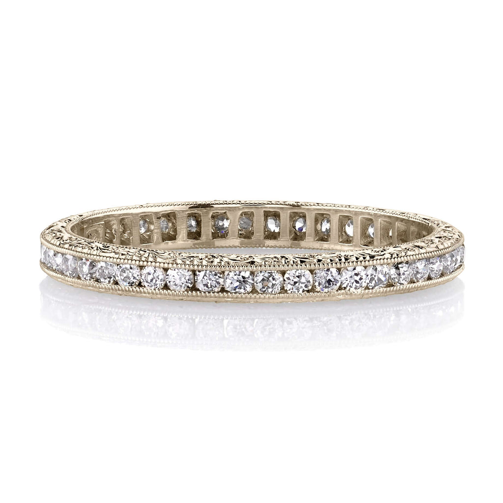 SINGLE STONE MADISON BAND | Approximately 0.40ctw old European cut diamonds channel set in a handcrafted eternity band. Available with polished or engraved sidewalls. Approximate band width 2.1mm.