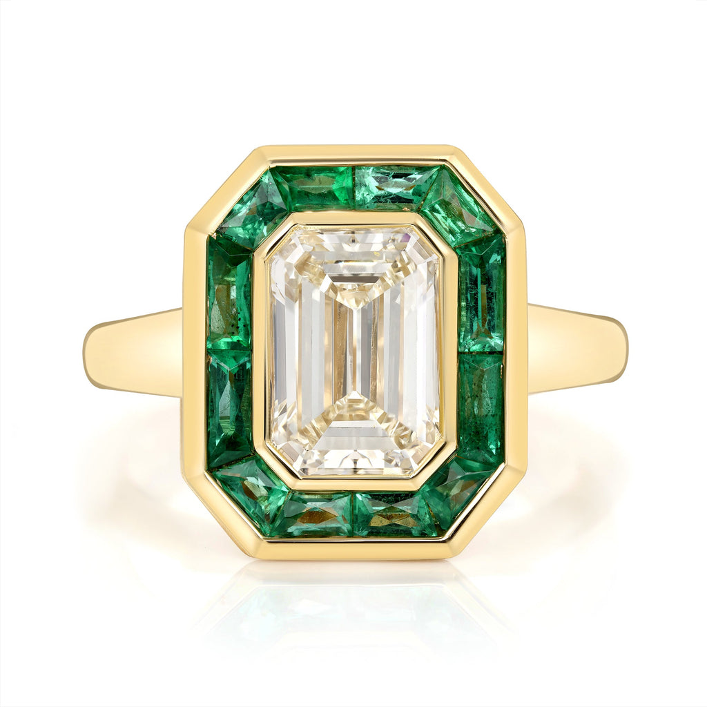 SINGLE STONE MARIA RING featuring 2.11ct N/VS1 GIA certified emerald cut diamond with 0.92ctw French cut green emeralds bezel set in a handcrafted 18K yellow gold mounting.