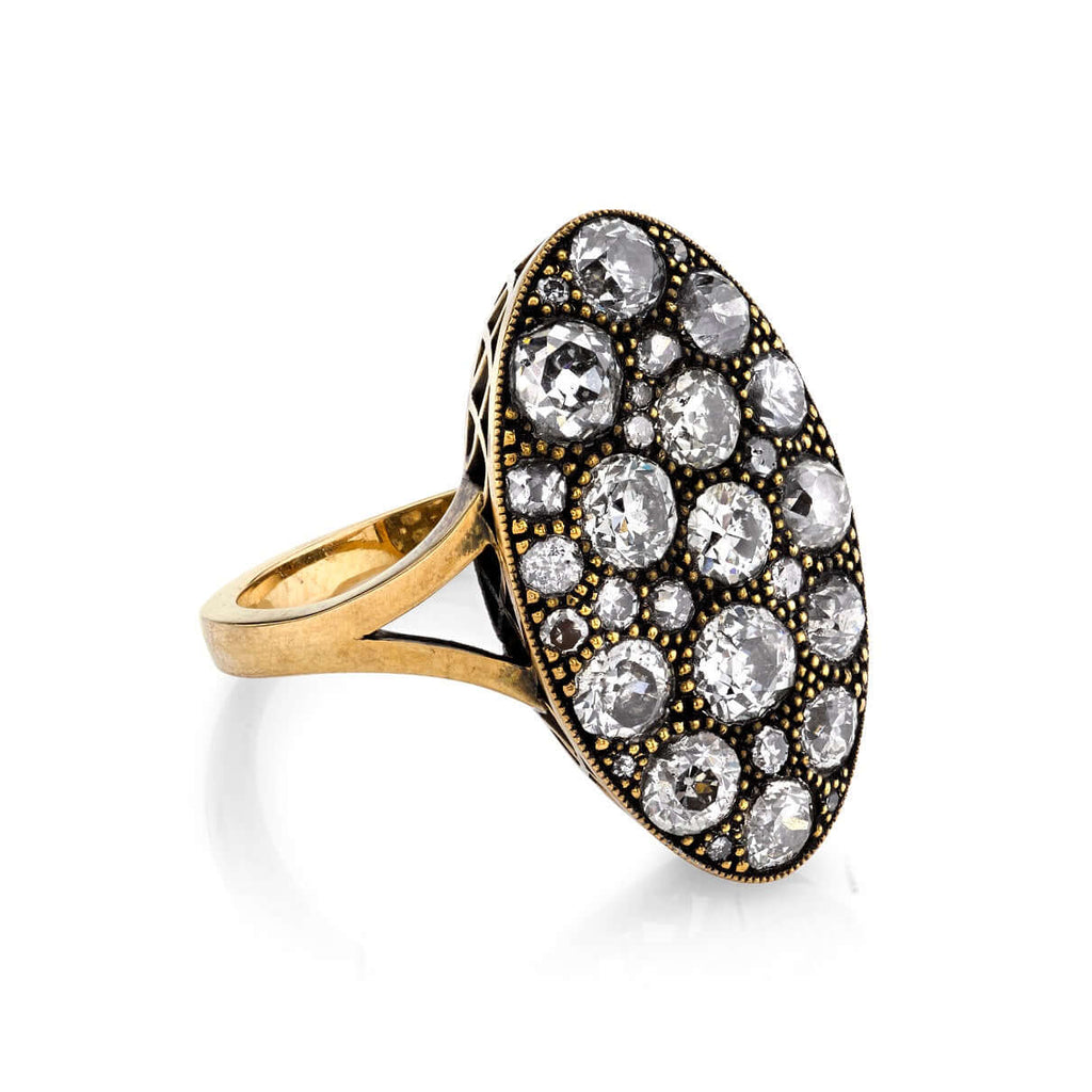 SINGLE STONE MOVAL COBBLESTONE RING featuring 2.96ctw old European, antique Old Mine, Round Brilliant, Single and antique Cushion cut diamonds set in a handcrafted oxidized 18K yellow gold mounting.