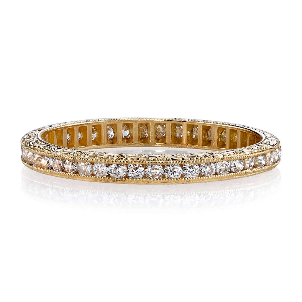 SINGLE STONE MADISON BAND | Approximately 0.40ctw old European cut diamonds channel set in a handcrafted eternity band. Available with polished or engraved sidewalls. Approximate band width 2.1mm.