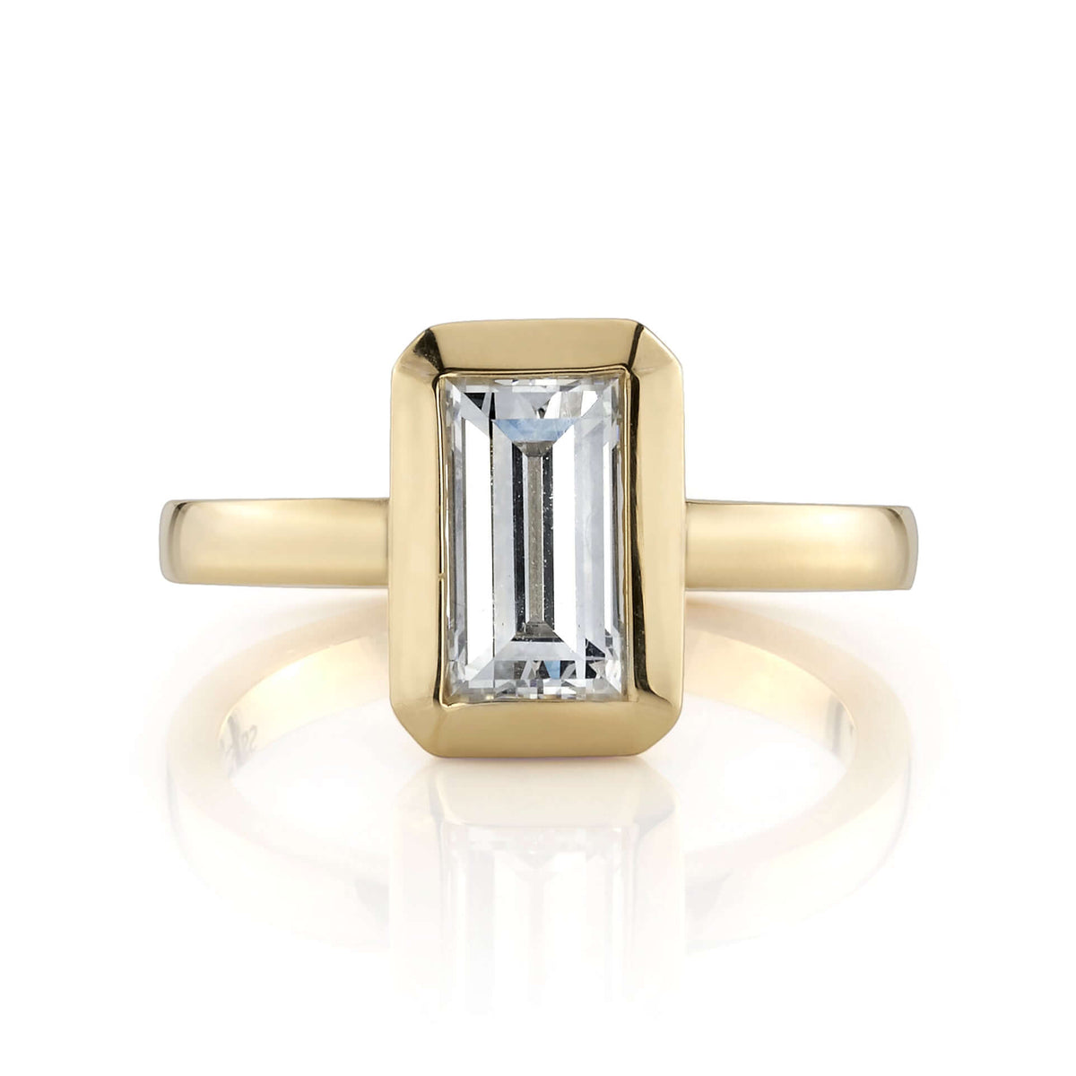 SINGLE STONE BEA RING featuring 1.27ct I/VS2 GIA certified rectangular step cut diamond set in a handcrafted 18K yellow gold mounting.