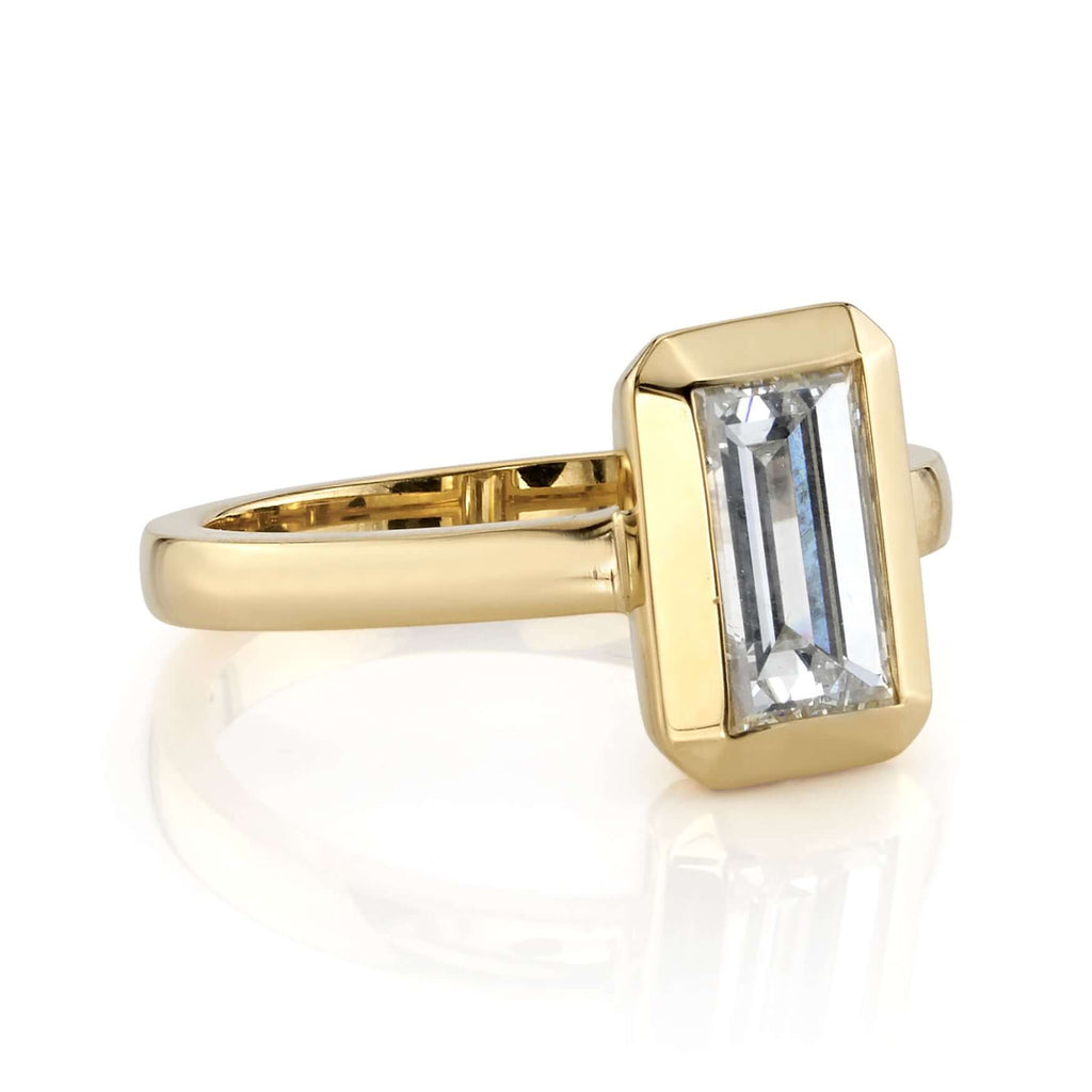 SINGLE STONE BEA RING featuring 1.27ct I/VS2 GIA certified rectangular step cut diamond set in a handcrafted 18K yellow gold mounting.