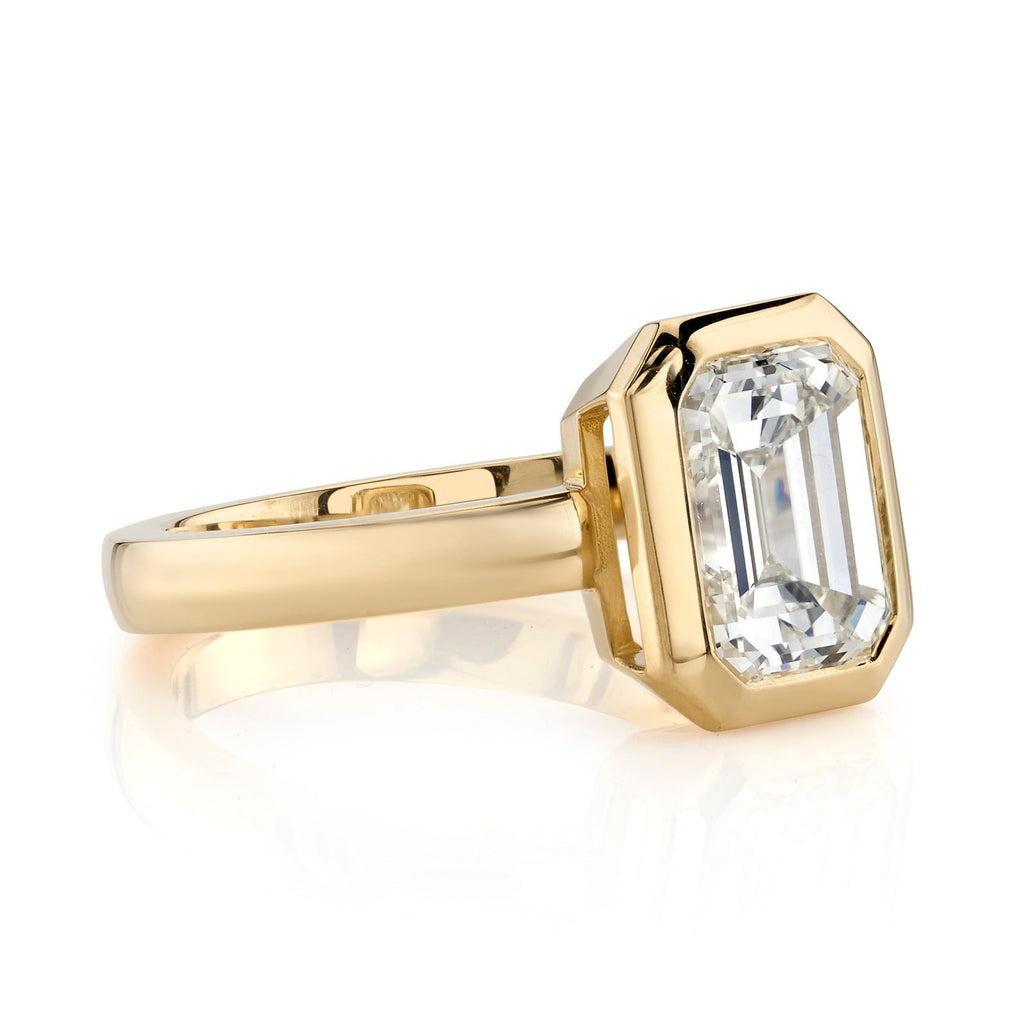 SINGLE STONE RAE RING featuring 2.28ct O-P/VS1 GIA certified emerald cut diamond bezel set in a handcrafted 18K yellow gold mounting.