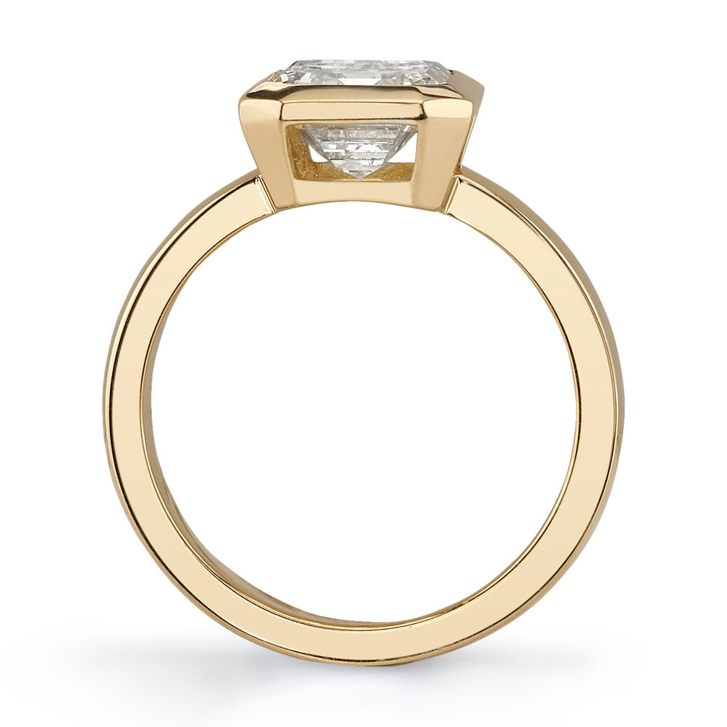 SINGLE STONE RAE RING featuring 2.28ct O-P/VS1 GIA certified emerald cut diamond bezel set in a handcrafted 18K yellow gold mounting.