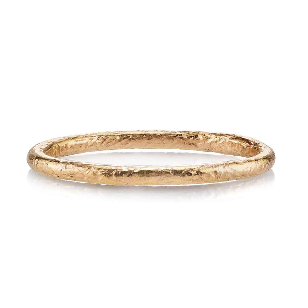 SINGLE STONE SMALL JANE BAND | 1.5mm handcrafted hammer finished gold band. Please inquire for additional customization.