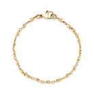 SINGLE STONE SMALL DOROTHY BRACELET featuring Handcrafted 18K yellow gold long bead bracelet. Bracelet measures 7.5".