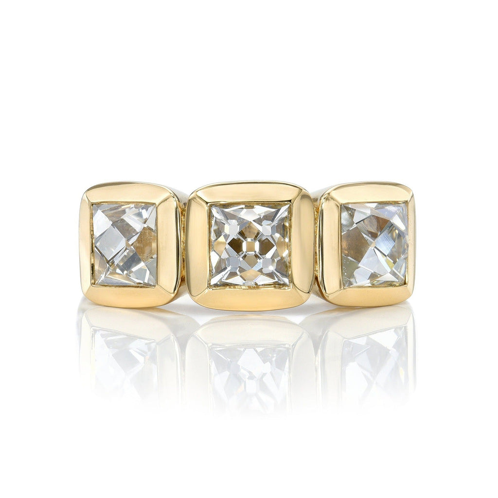 SINGLE STONE THREE STONE KARINA RING featuring 2.76ctw F-G/VS2-SI1 GIA certified French cut diamonds with 0.31ctw old European cut accent diamonds set in a handcrafted 18K yellow gold mounting.