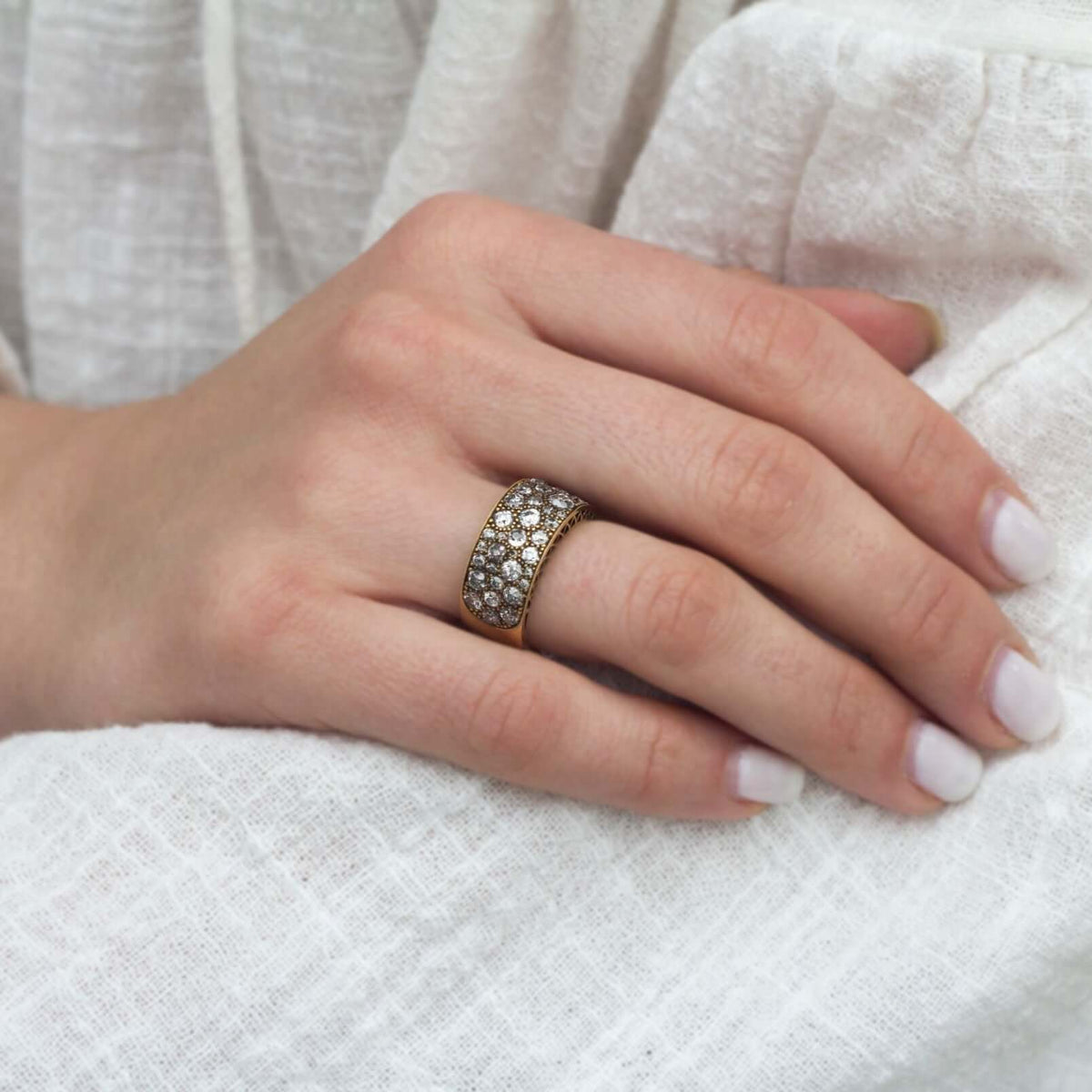 SINGLE STONE COBBLESTONE BAND BAND | Approximately 2.25ctw varying old cut and round brilliant cut diamonds set in a handcrafted 18K yellow gold band. Approximate band width 8.9mm. *Cobblestone pattern may vary from piece to piece Please inquire for addit