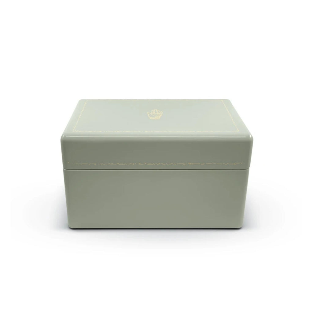 MINT TRUNK, Color: Mint with warm grey and green interior 3 levels of storage Wood with high lacquer finish Features delicate gold effect inlay Brass plated hardware Faux suede interior 11.8" x 8.3" x 6.3" Due to the nature of lacquer, there may be some v