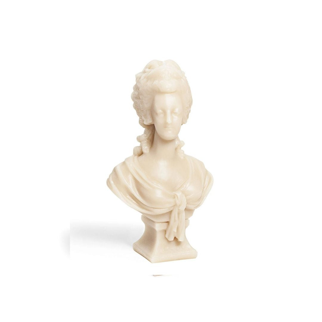 MARIE ANTOINETTE, This object is an idealized portrait of the queen instead of the evocation of a sovereign at the height of her power. The head is slightly turned to the right; the shoulders are covered with a swath of fabric for a natural effect; she is wearing a crown decorated with a fleur-delis and a row of pearls. As one of the most famous and controversial women in French History, Marie-Antoinette was the object of many artistic representations. 
Dimensions: 22 cm 
, Candle, Trudon